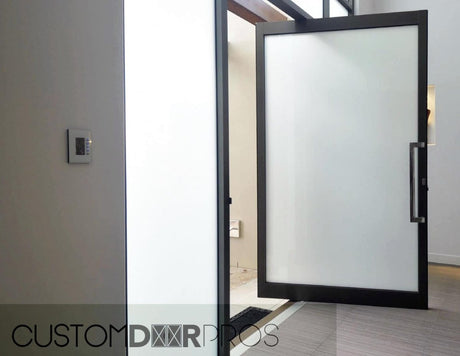 Minimalist Frosted Glass Pivot Door - Custom Iron Door Pros